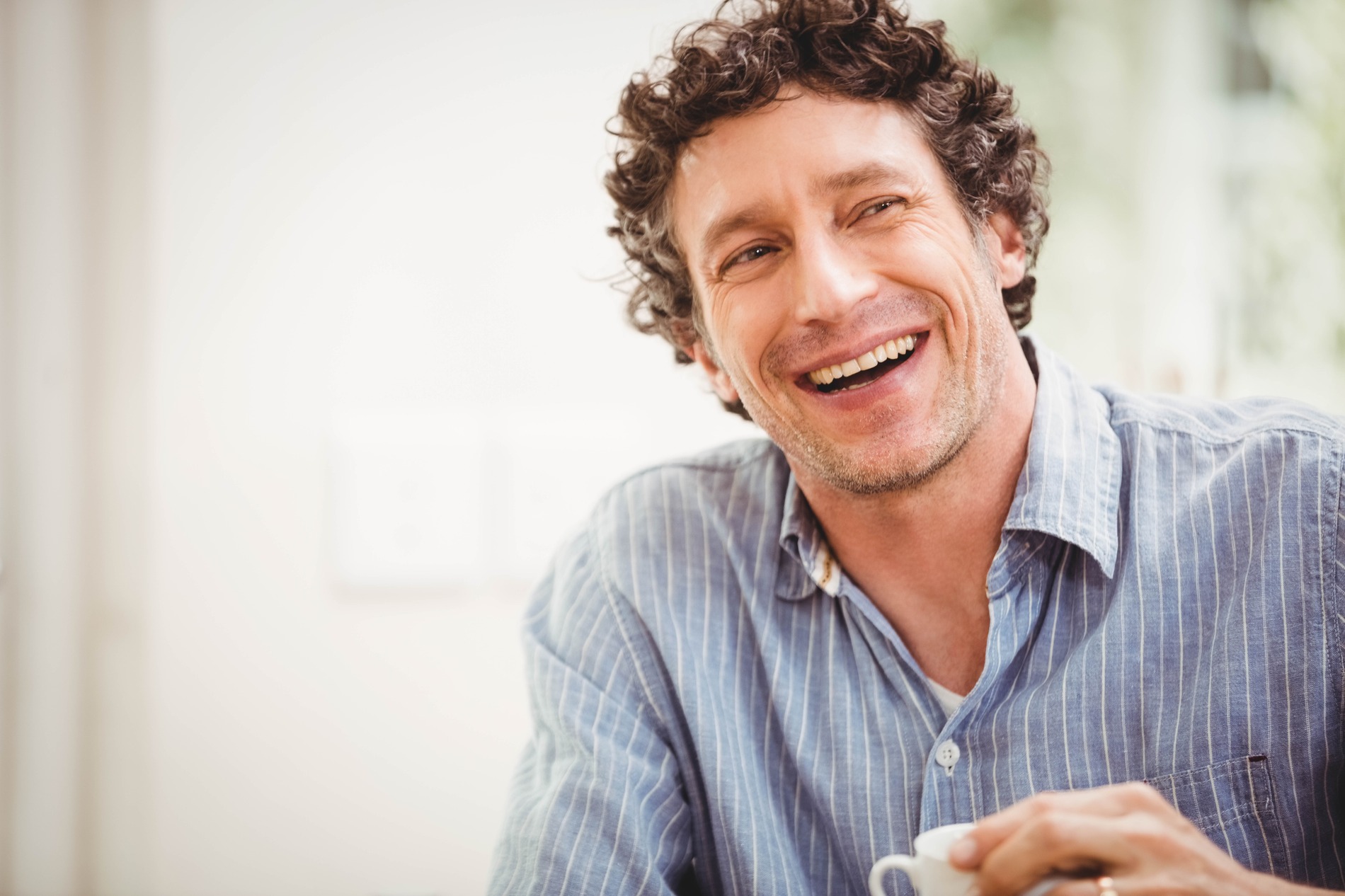 Man smiling after emergency dental care at Smile Haven Dental Studio