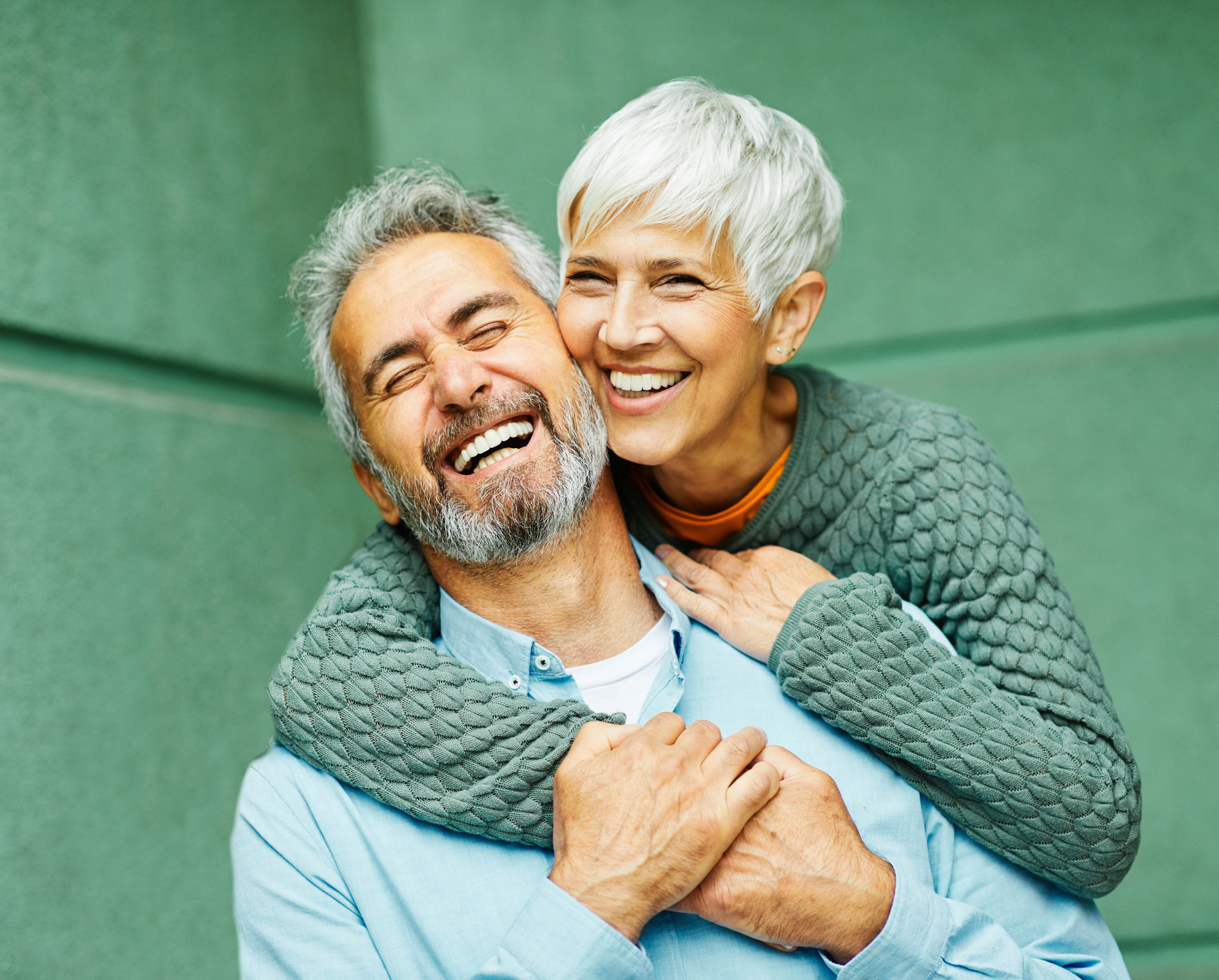 Couple hugging after signing up for a dental membership plan in St. Charles IL