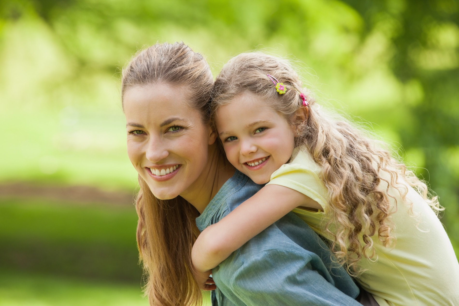 AdobeStock_62562043 v2 Mother and daughter excited for the cosemtic dental care in St Chalres IL