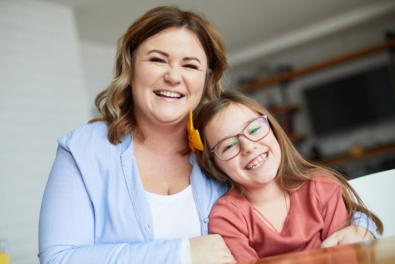 What-Are-Common-Dental-Issues-Treated-by-Pediatric-Dental-Care Mother and her childrens admiring their smiles after dental care in St Charles IL
