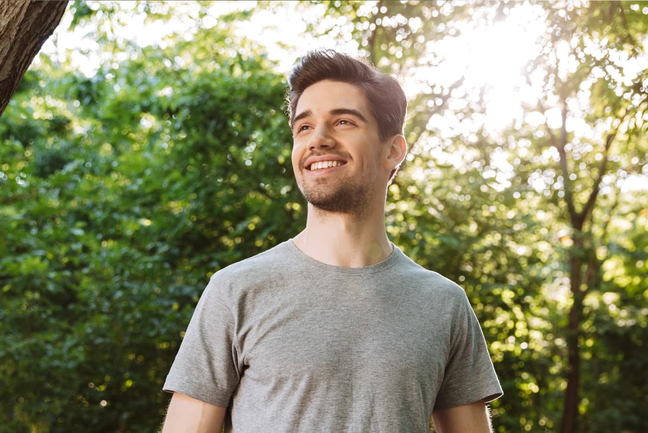 What-Is-General-Family-Dentistry Man smiling outside, happy with his family dental care at Smile Haven Dental Studio