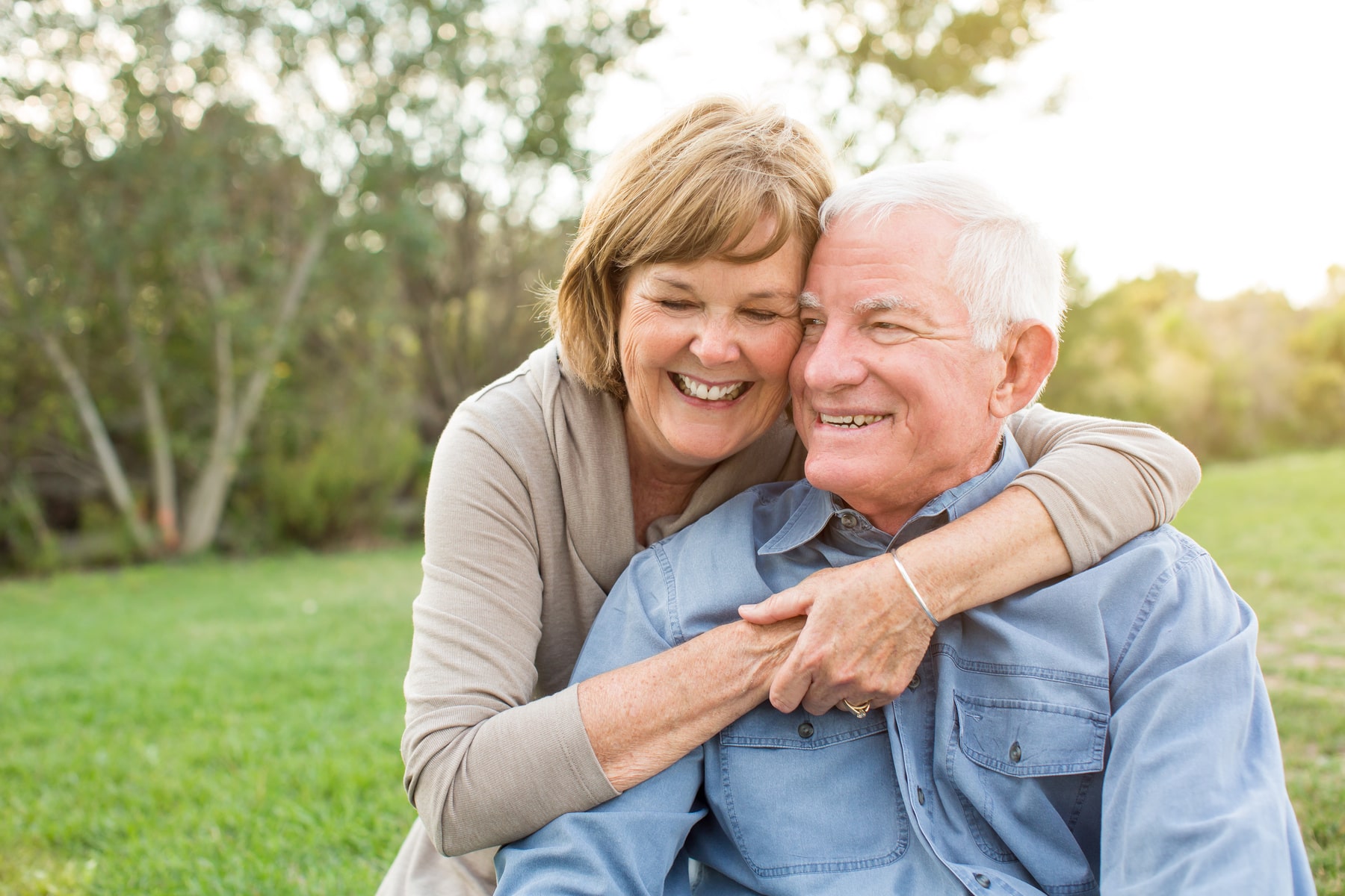 happy couple of patients smiling after their oral cancer screenings from Smile Haven Dental Studio in St Charles IL
