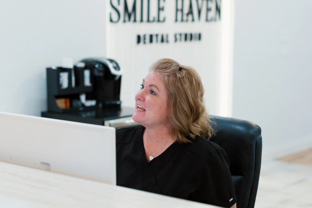 Woman smiling after dental extraction in St Charles IL